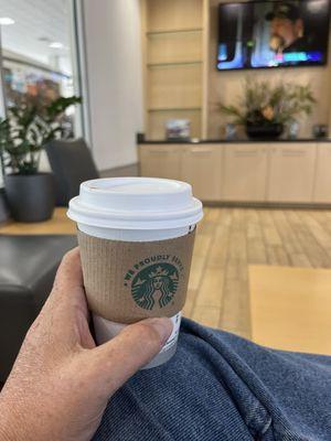 Waiting room has Starbucks coffee machine