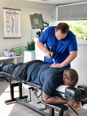 Dr. Kelan adjusting one of our amazing patients!