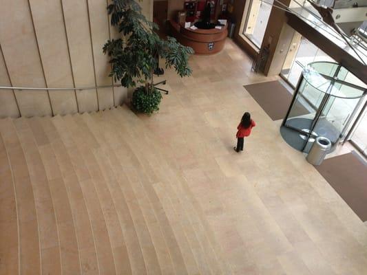 Overlooking front entrance, stairs and security desk.