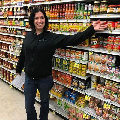 Heather showing off the variety of products available at Orcas Island Market.