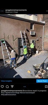 Brownstone repair in progress for facade restoration.