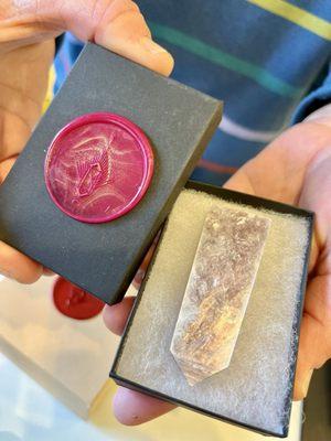 Second lepidolite piece with exceptional pink/pearlescence. The box is decorated with a pink wax stamp that has a dust of gold.