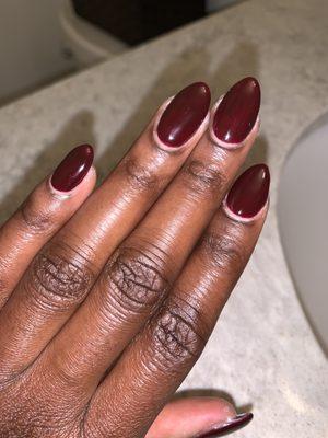 Full set with almond shaped nails and oxblood (deep red) gel polish