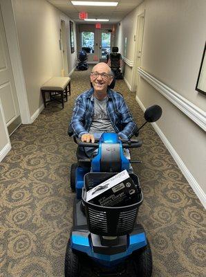 Happy customer loving their new mobility scooter.