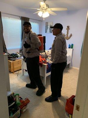 Luis giving thumbs up and Eric helping, inside my sons room.