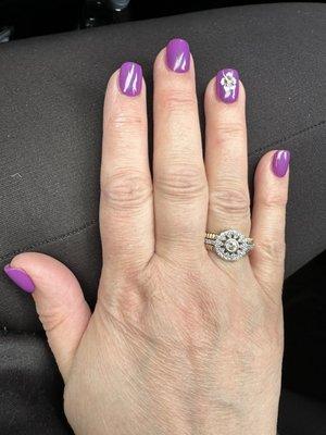 Purple nails with a white flower