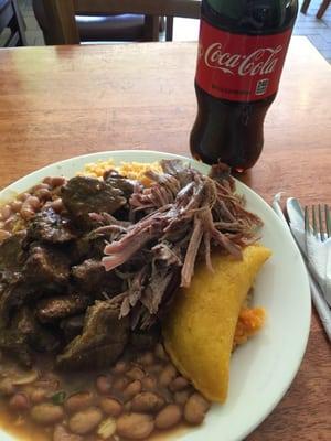 Rice, beans, beef empanada, stewed beef, pork, and a Coke for $10.