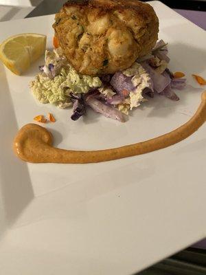 Our Maryland Crab Cake, served with Napa pineapple slaw and a whisper of smoky aioli.