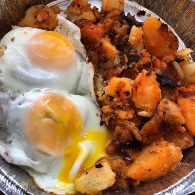 two sunny side up eggs with home fries. the absolute BOMB!