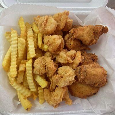 Fried shrimp, chicken and fries combo.