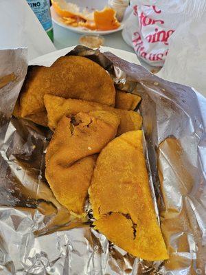 I bought 20 empanadas. They were in two small white bags. They were all crushed.