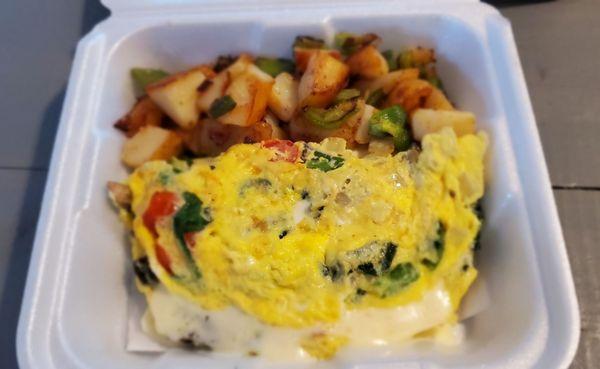 Veggie omelet & home fries with peppers & onions