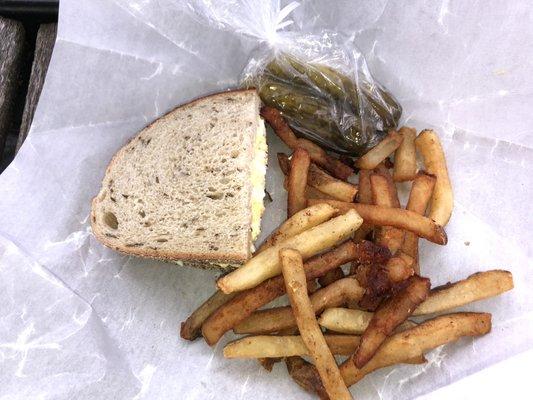 Eating an Egg salad, pickles & great fries at the park! Missing ketchup though.