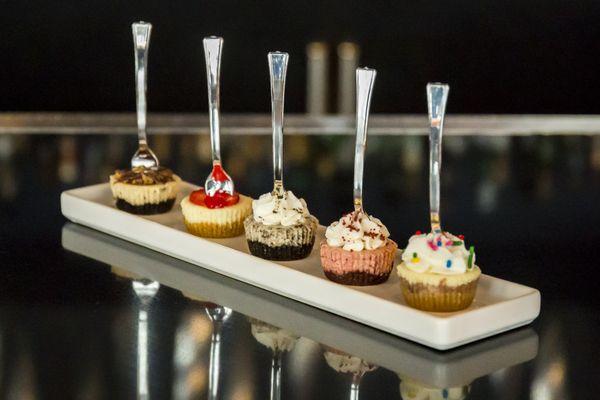 A variety of bite-sized cheesecakes by She Imagined Sweets