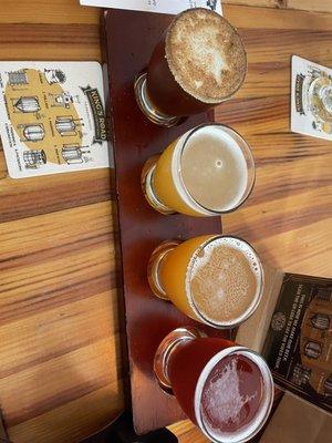 Flight with pumpkin beer, two hazy IPA's, and a hibiscus seltzer.