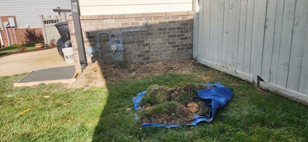 Mounds of rocky dirt against my house.  This was not tamped down or graded.  No attempts to do so.