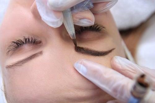 Professional permanent makeup treatment for eyebrows