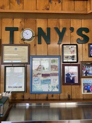 Tony's sign on the wall with famous customers and wonderful merits