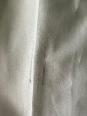 Ruined Ralph Lauren Polo dress shirt with black streaks on sleeve.