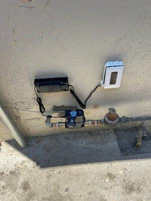 Outdoor water meter installation with electronic components. Quality service you can trust!