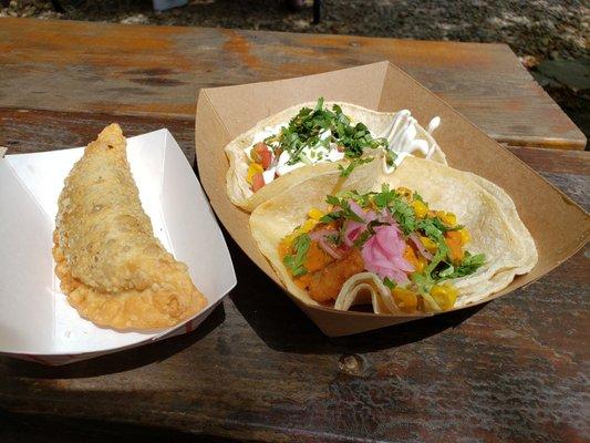 Two tacos and empanada.