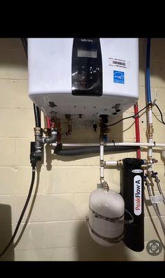 Tankless water heater installation in Gainesville, Ga for residential house. Navien Condensing water heater