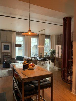 Pendant light installed in kitchen and view of ding area chandelier