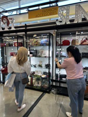 Handbags in display cases