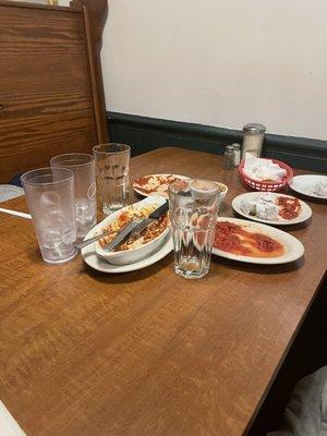 The waitress and food runners don't bus the tables in between courses--they just leave it a mess during the entire meal!