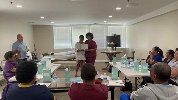 Our staff receiving their certificate of partificpant at the Training Program at our office.