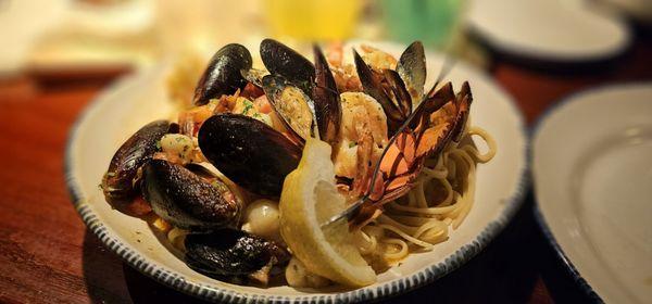 Bar harbor lobster bake. Lobster, shrimp, scallop, and mussels over a bed of linguini in white wine sauce.