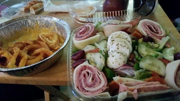 Antipasto salad and salted curly fries wit salted cheesey salty salt.