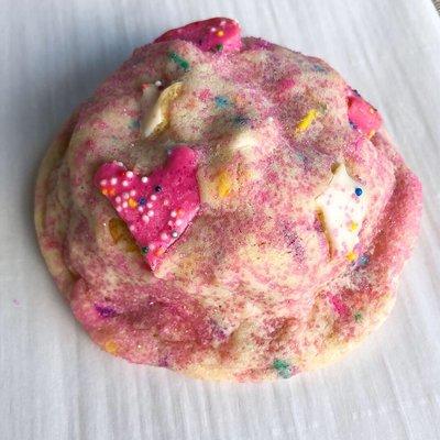 Carnival Cookie- Sugar cookie stuffed with a White Fudge Ding Dong, smothered in frosted animal crackers and rolled in pink sanding sugar!