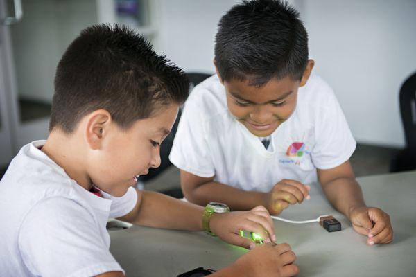 Experimenting with Little Bits circuits is exciting! The students connect a power source to circuits that make different things happen.