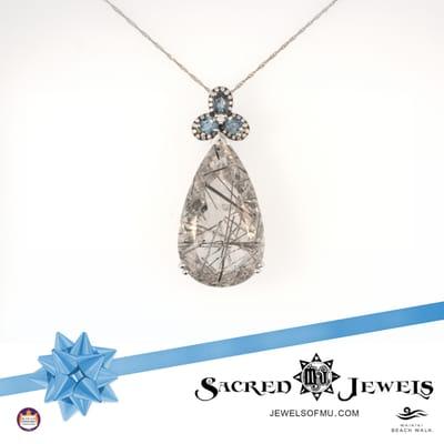 Tourmalinated Quartz Pendant
 39.62ct Quartz with Black Tourmaline strands
 .17ct Diamond
 .79ct Aquamarine