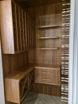 Wine room made out of walnut wood and finished with clear lacquer.