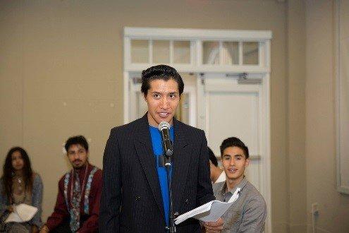 Teen students share self-written monologues at a public art showcase.