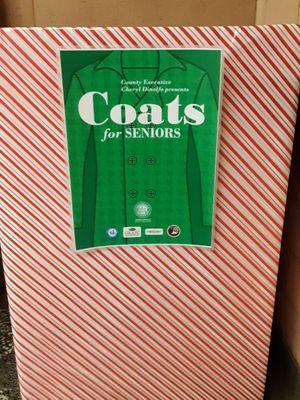 Coat collection box. They're collecting coats for seniors in need. Nothing says Merry Christmas like helping someone.