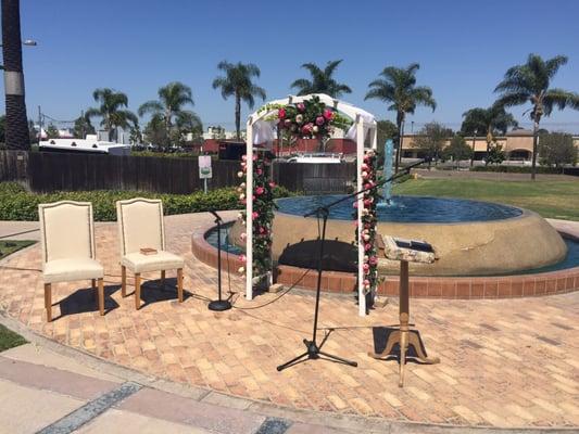 Wedding ceremony in front of water fountain