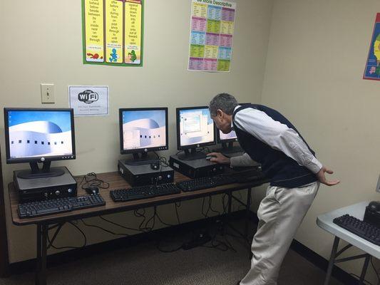 Mr. Matos setting up computer computer lab....