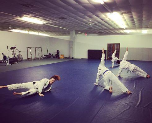 Betsy at white belt: noodle wrists can't side plank.