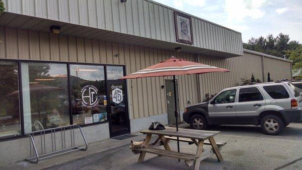 The front! Coffee wafting through the door - that picnic table is perfect on a nice day