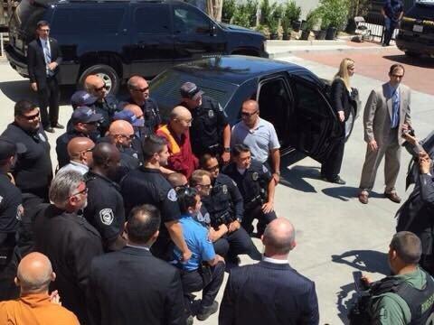 Our security guards taking a picture with the Dalai Lama