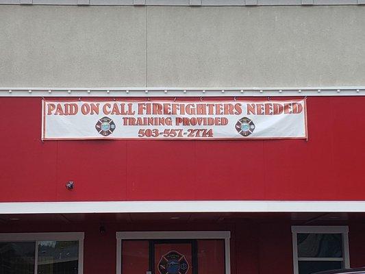 Banner seeking firefighters currently displayed on building. 5/20/19