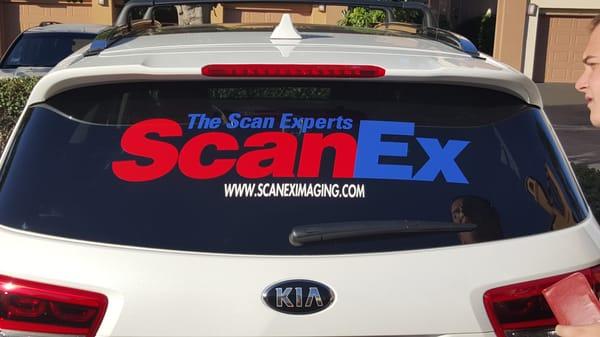 Logo on car advertising on wheels.