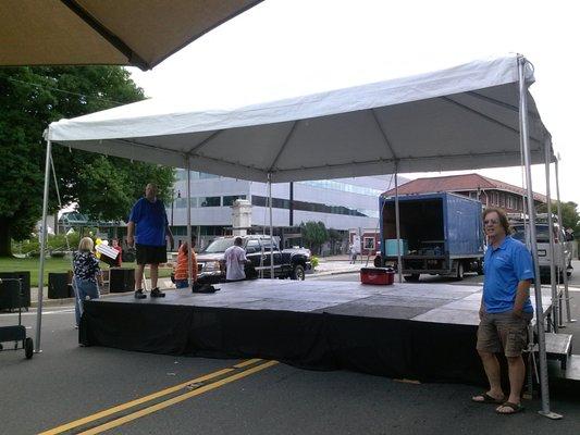 Example of a tent covered 16' x 20' stage for a street fair.