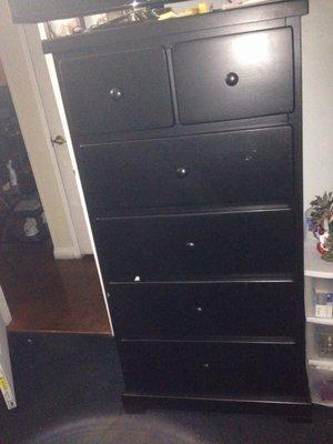 Black wood dresser with two split drawers on top. Took me 4 months to receive it.