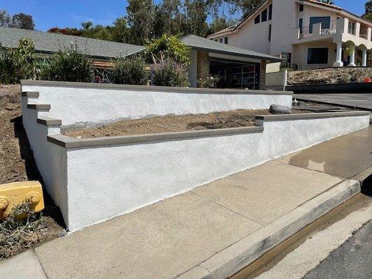 Planter walls with custom concrete caps