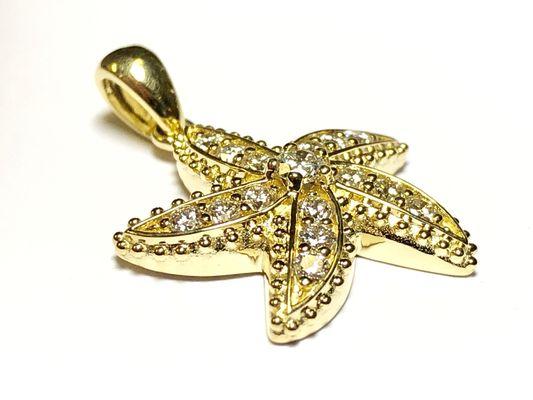 18k gold star fish pendant one of Curt's most popular options. He recently added the much more affordable sterling silver and CZ version.