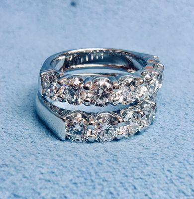 Half way around diamond wedding bands in platinum  0.28 of a carat each stone F color SI1 clearly.